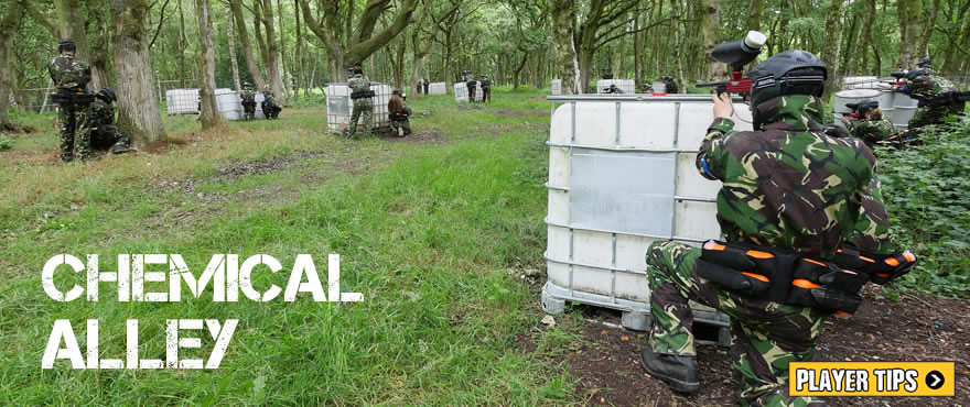 <Photograph of paintball players in the woods chemical alley>