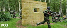 <Small image pod field paintball players near a tree>